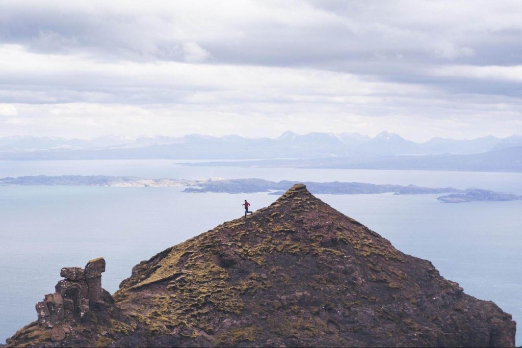 A person descending a brown mountain on the Isle of Skye in Scotland. Photo: Alex Gorham