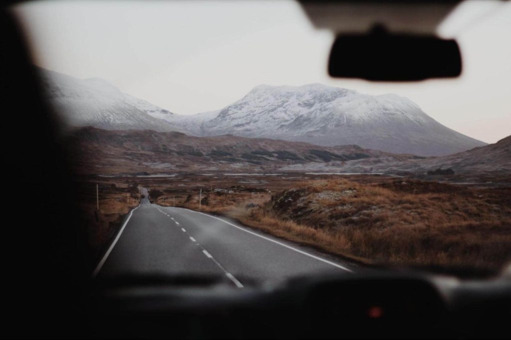 Grassy verges and snow-capped mountains in Fort Augustus, Scotland. Photo: Cierra Henderson